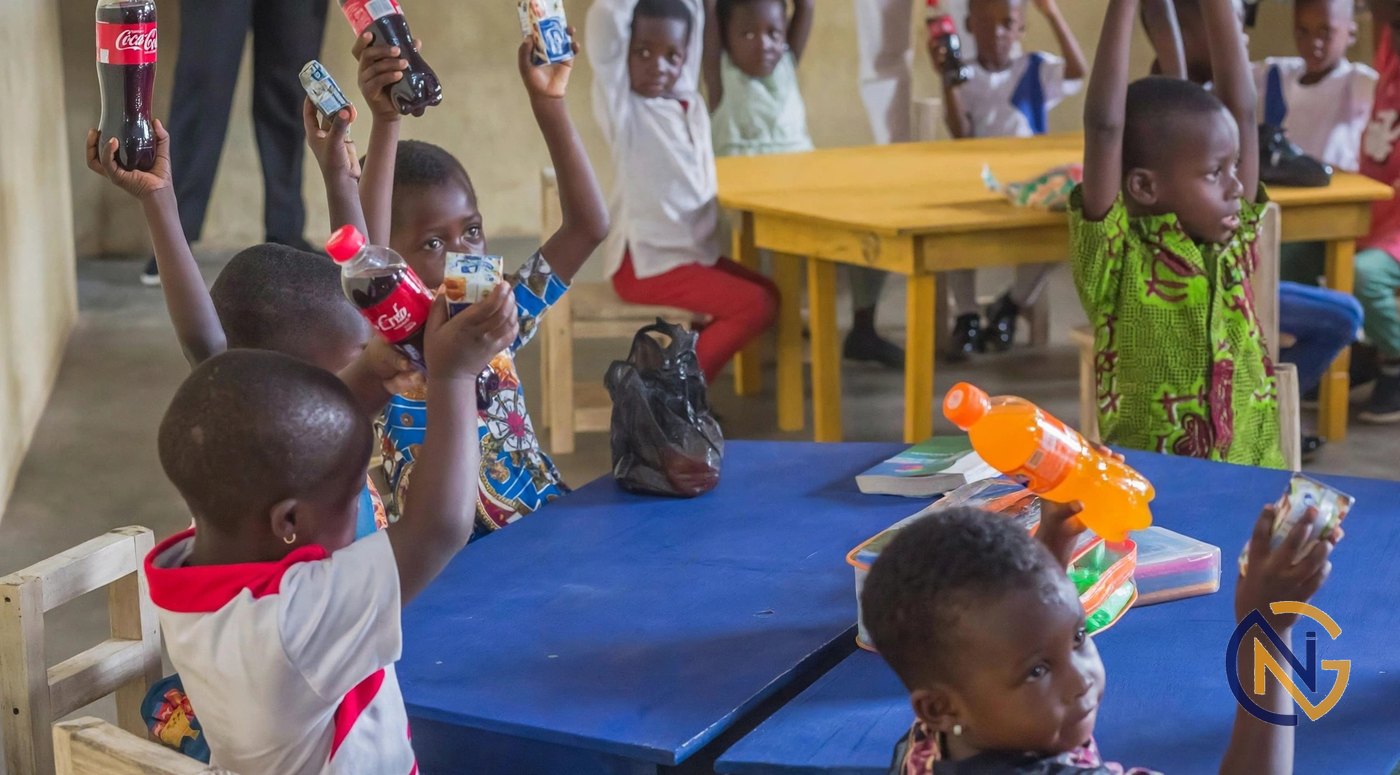 Children celebrating with gifts at an outreach event